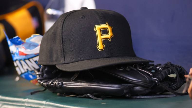 Sep 8, 2023; Atlanta, Georgia, USA; A detailed view of a Pittsburgh Pirates hat and glove before a game against the Pittsburgh Pirates in the first inning at Truist Park. Mandatory Credit: Brett Davis-USA TODAY Sports