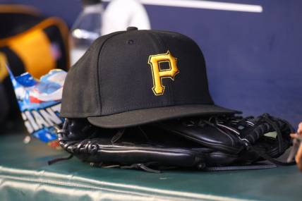 Sep 8, 2023; Atlanta, Georgia, USA; A detailed view of a Pittsburgh Pirates hat and glove before a game against the Pittsburgh Pirates in the first inning at Truist Park. Mandatory Credit: Brett Davis-USA TODAY Sports