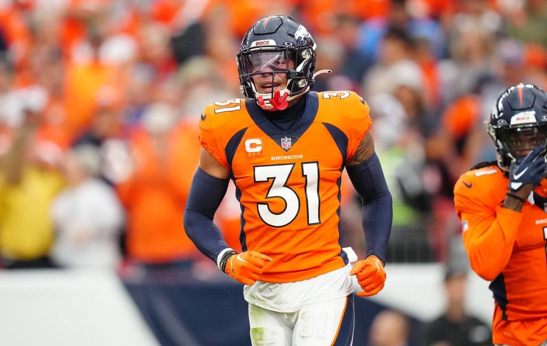 Sep 10, 2023; Denver, Colorado, USA; Denver Broncos safety Justin Simmons (31) reacts to a turnover in the third quarter against the Las Vegas Raiders at Empower Field at Mile High. Mandatory Credit: Ron Chenoy-USA TODAY Sports