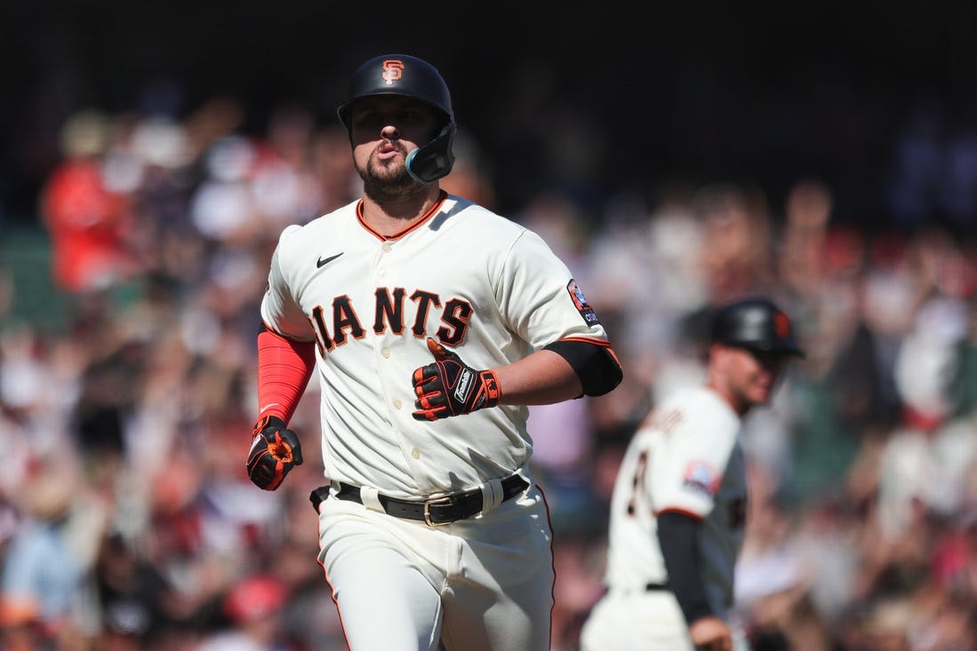 Sep 13, 2023; San Francisco, California, USA; San Francisco Giants third baseman J.D. Davis (7) reacts after hitting a three run home run during the eighth inning against the Cleveland Guardians at Oracle Park. Mandatory Credit: Sergio Estrada-USA TODAY Sports