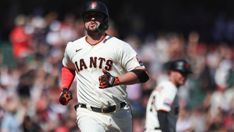 Sep 13, 2023; San Francisco, California, USA; San Francisco Giants third baseman J.D. Davis (7) reacts after hitting a three run home run during the eighth inning against the Cleveland Guardians at Oracle Park. Mandatory Credit: Sergio Estrada-USA TODAY Sports