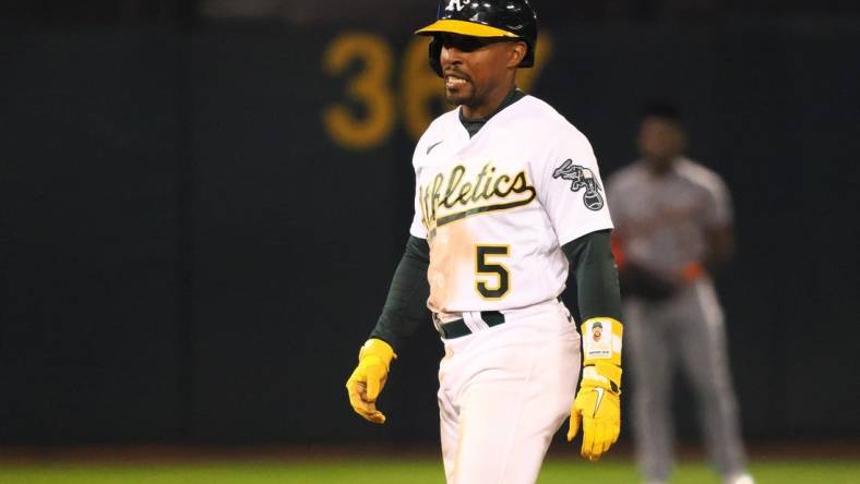 Sep 22, 2023; Oakland, California, USA; Oakland Athletics left fielder Tony Kemp (5) walks off an injury during the sixth inning against the Detroit Tigers at Oakland-Alameda County Coliseum. Mandatory Credit: Kelley L Cox-USA TODAY Sports