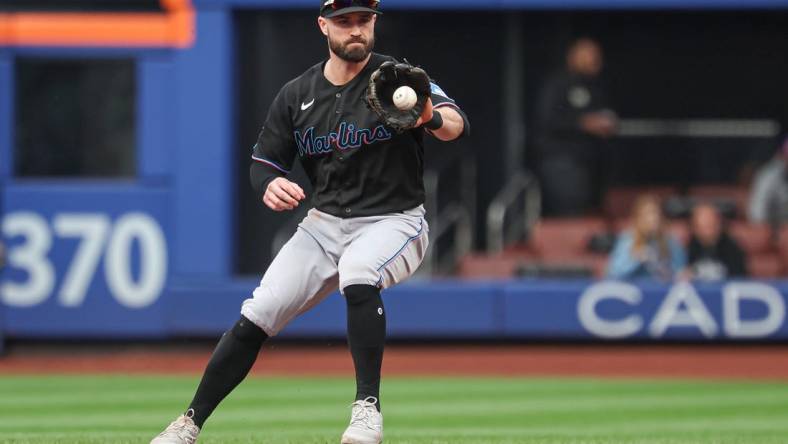 Sep 27, 2023; New York City, New York, USA; Miami Marlins shortstop Jon Berti (5) fields he ball during the third inning against the New York Mets at Citi Field. Mandatory Credit: Vincent Carchietta-USA TODAY Sports