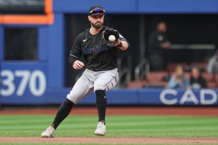 Sep 27, 2023; New York City, New York, USA; Miami Marlins shortstop Jon Berti (5) fields he ball during the third inning against the New York Mets at Citi Field. Mandatory Credit: Vincent Carchietta-USA TODAY Sports