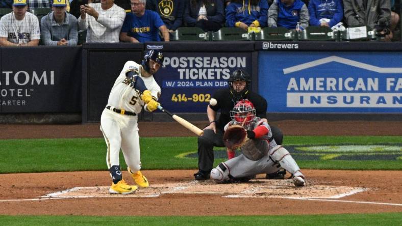 Sep 28, 2023; Milwaukee, Wisconsin, USA; Milwaukee Brewers outfielder Garrett Mitchell (5) hits a double against the St. Louis Cardinals in the fourth inning at American Family Field. Mandatory Credit: Michael McLoone-USA TODAY Sports