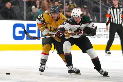 Sep 29, 2023; Las Vegas, Nevada, USA; Vegas Golden Knights left wing Tyler Benson (67) slows Arizona Coyotes right wing Josh Doan (91) during the first period at T-Mobile Arena. Mandatory Credit: Stephen R. Sylvanie-USA TODAY Sports