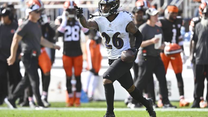 Baltimore Ravens safety Geno Stone (26) celebrates after intercepting a pass in the first quarter against the Cleveland Browns at Cleveland Browns Stadium. Mandatory Credit: David Richard-USA TODAY Sports