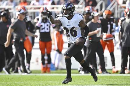 Baltimore Ravens safety Geno Stone (26) celebrates after intercepting a pass in the first quarter against the Cleveland Browns at Cleveland Browns Stadium. Mandatory Credit: David Richard-USA TODAY Sports