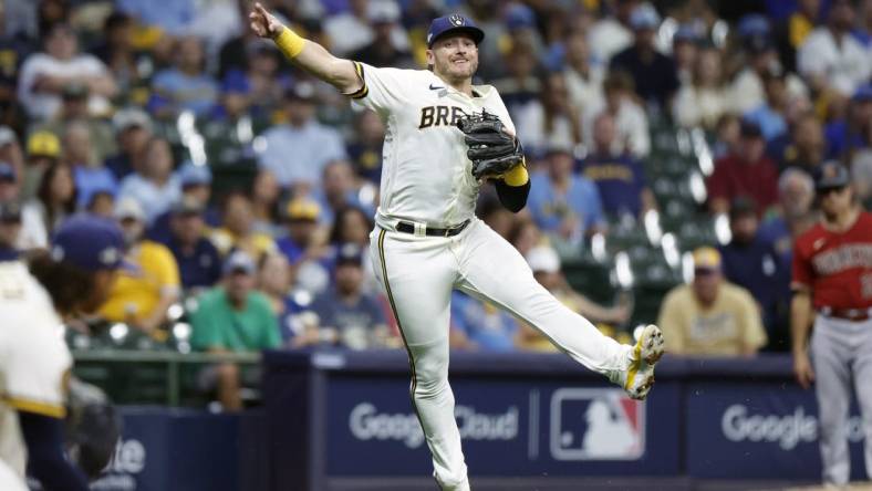 Oct 4, 2023; Milwaukee, Wisconsin, USA; Milwaukee Brewers third baseman Josh Donaldson (3) throws to first in the fourth inning against the Arizona Diamondbacks during game two of the Wildcard series for the 2023 MLB playoffs at American Family Field. Mandatory Credit: Kamil Krzaczynski-USA TODAY Sports