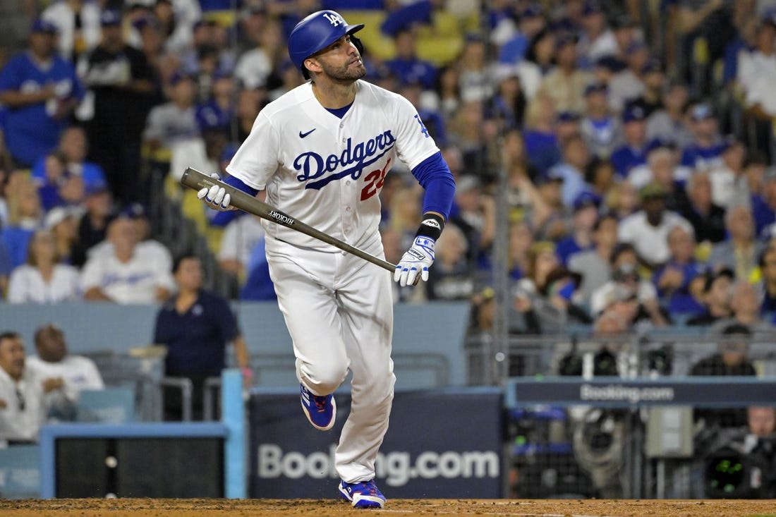 Oct 9, 2023; Los Angeles, California, USA; Los Angeles Dodgers designated hitter J.D. Martinez (28) hits a home run against the Arizona Diamondbacks during the fourth inning for game two of the NLDS for the 2023 MLB playoffs at Dodger Stadium. Mandatory Credit: Jayne Kamin-Oncea-USA TODAY Sports