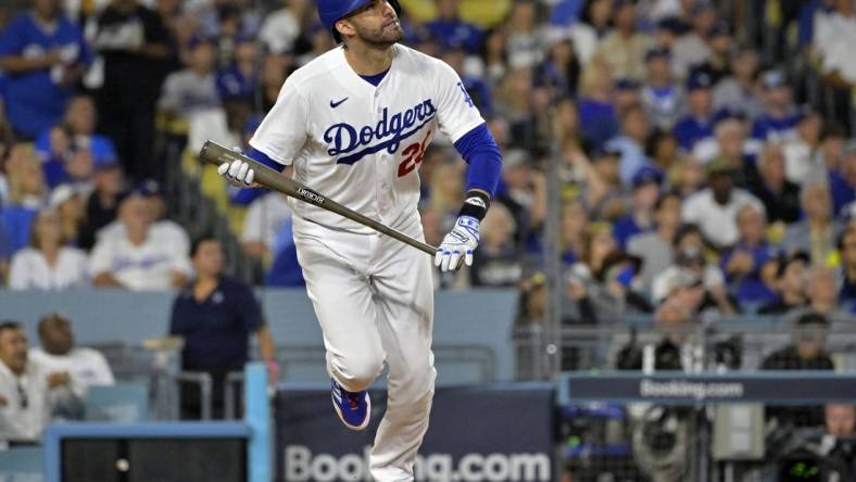 Oct 9, 2023; Los Angeles, California, USA; Los Angeles Dodgers designated hitter J.D. Martinez (28) hits a home run against the Arizona Diamondbacks during the fourth inning for game two of the NLDS for the 2023 MLB playoffs at Dodger Stadium. Mandatory Credit: Jayne Kamin-Oncea-USA TODAY Sports