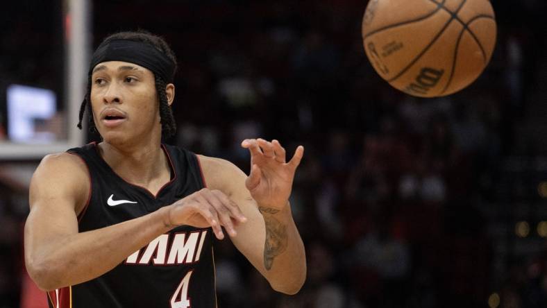 Oct 20, 2023; Houston, Texas, USA; Miami Heat guard R.J. Hampton (4) passes against the Houston Rockets  in the fourth quarter at Toyota Center. Mandatory Credit: Thomas Shea-USA TODAY Sports