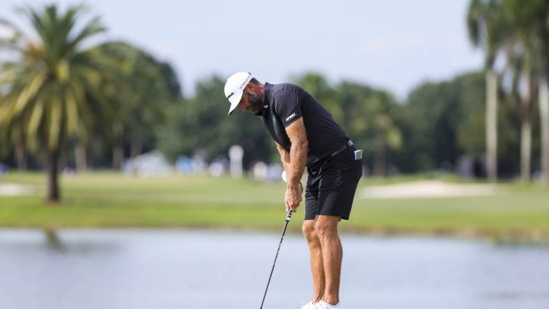 Oct 22, 2023; Doral, Florida, USA; Dustin Johnson putts on the eighth green during the final round of the LIV Golf Miami golf tournament at Trump National Doral. Mandatory Credit: Sam Navarro-USA TODAY Sports