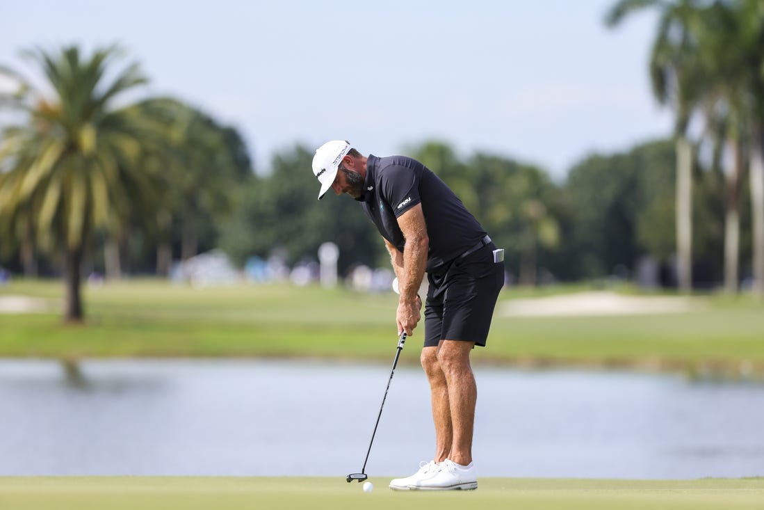 Oct 22, 2023; Doral, Florida, USA; Dustin Johnson putts on the eighth green during the final round of the LIV Golf Miami golf tournament at Trump National Doral. Mandatory Credit: Sam Navarro-USA TODAY Sports