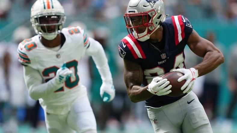 Oct 29, 2023; Miami Gardens, Florida, USA; New England Patriots wide receiver Kendrick Bourne (84) runs the ball for a touchdown against the Miami Dolphins during the first half at Hard Rock Stadium. Mandatory Credit: Jasen Vinlove-USA TODAY Sports