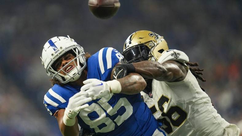 Indianapolis Colts tight end Drew Ogletree (85) is unable to receive thanks to defensive pressure from New Orleans Saints linebacker Demario Davis (56) on Sunday, Oct. 29, 2023, at Lucas Oil Stadium in Indianapolis.