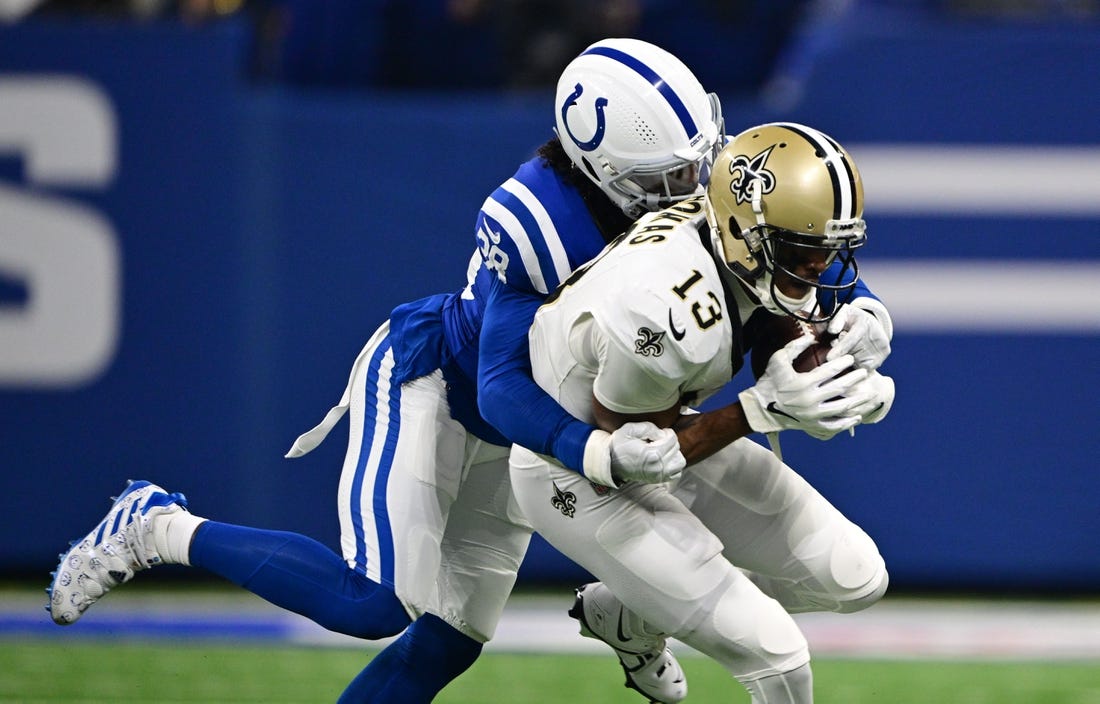 Oct 29, 2023; Indianapolis, Indiana, USA; Indianapolis Colts cornerback Tony Brown (38) tackles New Orleans Saints wide receiver Michael Thomas (13) during the first quarter at Lucas Oil Stadium. Mandatory Credit: Marc Lebryk-USA TODAY Sports