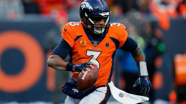 Oct 29, 2023; Denver, Colorado, USA; Denver Broncos quarterback Russell Wilson (3) scrambles in the fourth quarter against the Kansas City Chiefs at Empower Field at Mile High. Mandatory Credit: Isaiah J. Downing-USA TODAY Sports