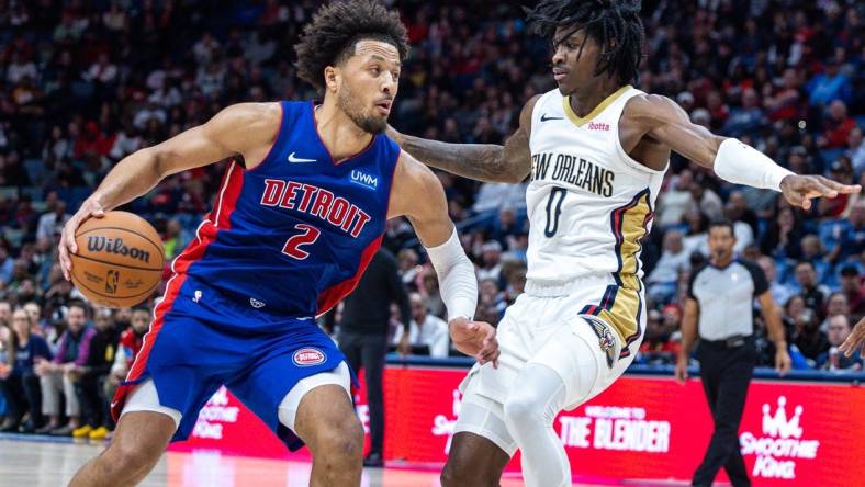Nov 2, 2023; New Orleans, Louisiana, USA; Detroit Pistons guard Cade Cunningham (2) drives to the basket against New Orleans Pelicans guard Dereon Seabron (0) during the second half at the Smoothie King Center. Mandatory Credit: Stephen Lew-USA TODAY Sports