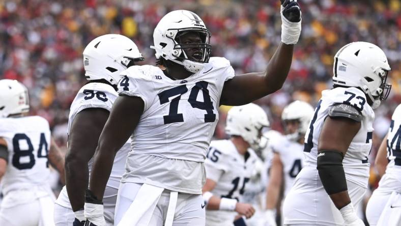 Nov 4, 2023; College Park, Maryland, USA;  Penn State Nittany Lions offensive lineman Olumuyiwa Fashanu (74) celebrates after a first half touchdown against the Maryland Terrapins at SECU Stadium. Mandatory Credit: Tommy Gilligan-USA TODAY Sports