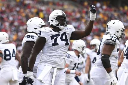 Nov 4, 2023; College Park, Maryland, USA;  Penn State Nittany Lions offensive lineman Olumuyiwa Fashanu (74) celebrates after a first half touchdown against the Maryland Terrapins at SECU Stadium. Mandatory Credit: Tommy Gilligan-USA TODAY Sports