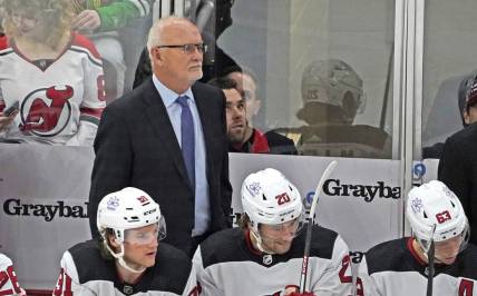 Nov 5, 2023; Chicago, Illinois, USA; New Jersey Devils head coach Lindy Ruff stands behind the bench during the first period at United Center. Mandatory Credit: David Banks-USA TODAY Sports