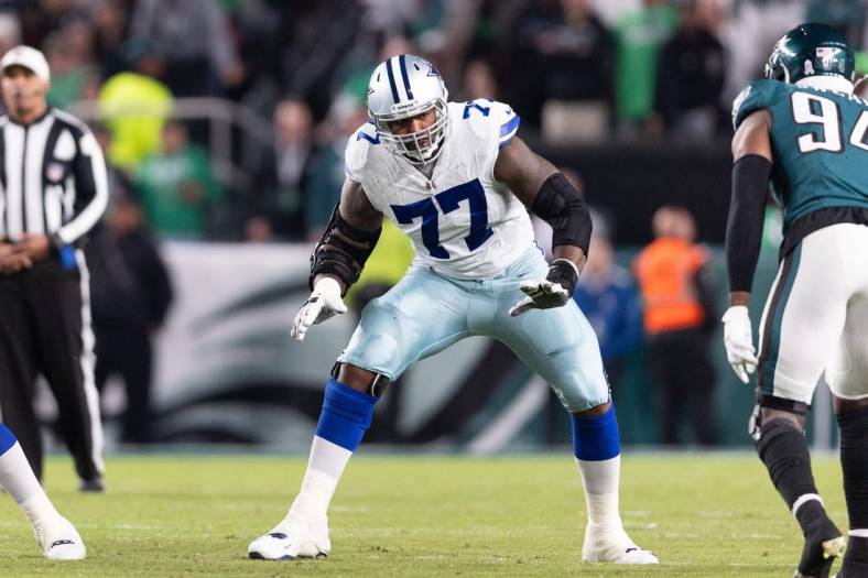 Nov 5, 2023; Philadelphia, Pennsylvania, USA; Dallas Cowboys offensive tackle Tyron Smith (77) in action against the Philadelphia Eagles at Lincoln Financial Field. Mandatory Credit: Bill Streicher-USA TODAY Sports