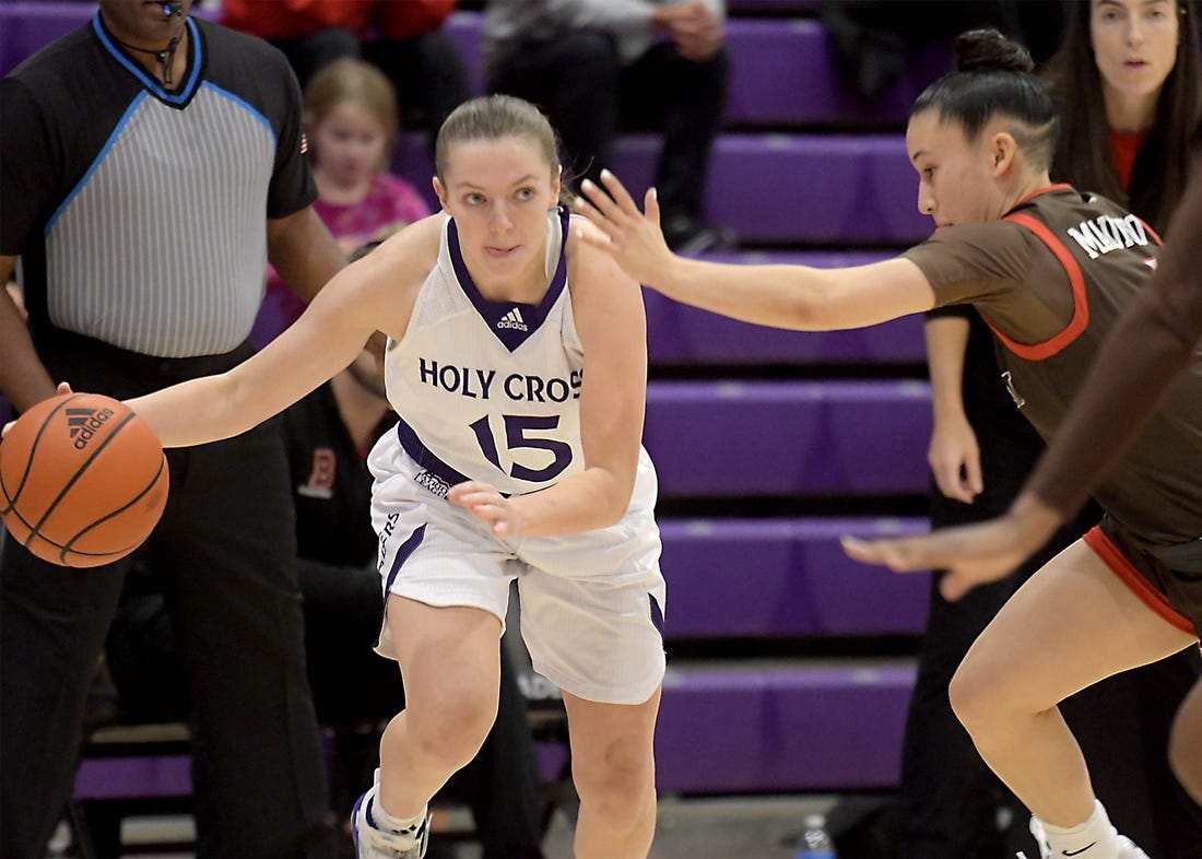 Holy Cross' Cara McCormack moves the ball upcourt as she is defended by Brown's Isabella Mauricio, Thursday, Nov. 9, 2023.