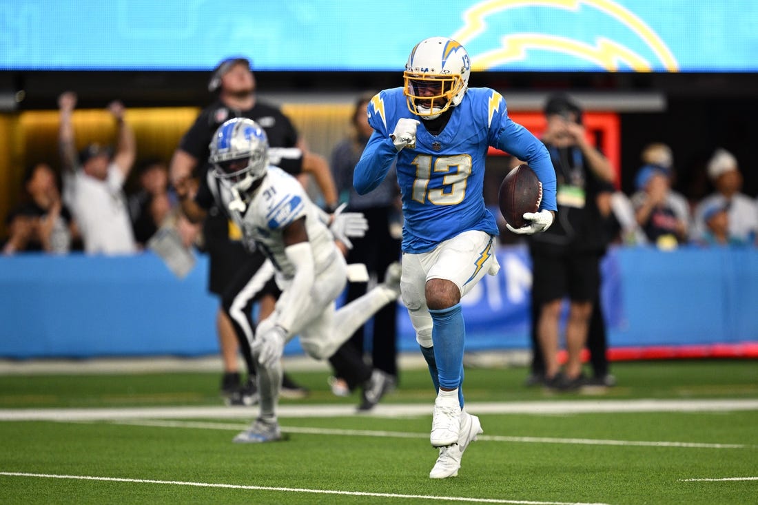 Nov 12, 2023; Inglewood, California, USA; Los Angeles Chargers wide receiver Keenan Allen (13) runs the ball for a touchdown after a catch against the Detroit Lions during the second half at SoFi Stadium. Mandatory Credit: Orlando Ramirez-USA TODAY Sports