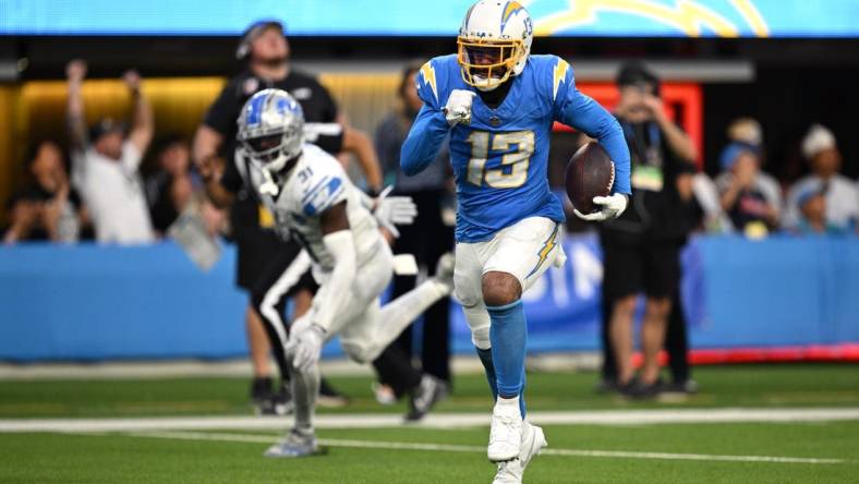 Nov 12, 2023; Inglewood, California, USA; Los Angeles Chargers wide receiver Keenan Allen (13) runs the ball for a touchdown after a catch against the Detroit Lions during the second half at SoFi Stadium. Mandatory Credit: Orlando Ramirez-USA TODAY Sports