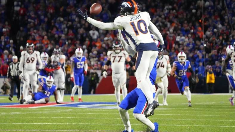 Nov 13, 2023; Orchard Park, New York, USA; Buffalo Bills cornerback Taron Johnson (7) pushes Denver Broncos wide receiver Jerry Jeudy (10) attempting to make a catch and is called for pass interference during the second half at Highmark Stadium. Mandatory Credit: Gregory Fisher-USA TODAY Sports