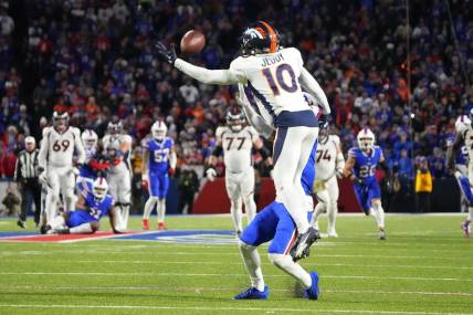 Nov 13, 2023; Orchard Park, New York, USA; Buffalo Bills cornerback Taron Johnson (7) pushes Denver Broncos wide receiver Jerry Jeudy (10) attempting to make a catch and is called for pass interference during the second half at Highmark Stadium. Mandatory Credit: Gregory Fisher-USA TODAY Sports