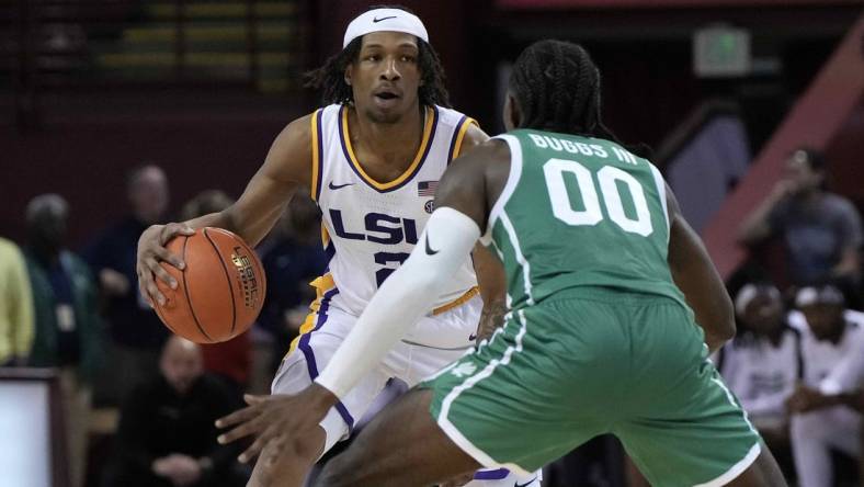 Nov 17, 2023; Charleston, SC, USA; LSU Tigers guard Mike Williams III (2) is guarded by North Texas Mean Green guard John Buggs III (00) in the second half at TD Arena. Mandatory Credit: David Yeazell-USA TODAY Sports