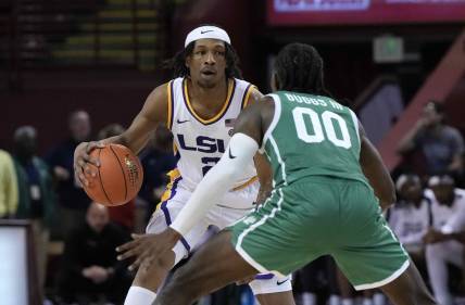 Nov 17, 2023; Charleston, SC, USA; LSU Tigers guard Mike Williams III (2) is guarded by North Texas Mean Green guard John Buggs III (00) in the second half at TD Arena. Mandatory Credit: David Yeazell-USA TODAY Sports