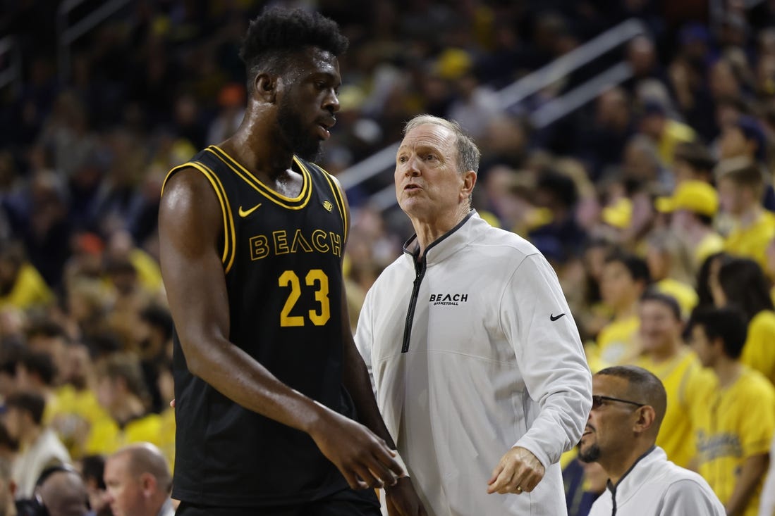 Nov 17, 2023; Ann Arbor, Michigan, USA;  Long Beach State 49ers head coach Dan Monson talks to 49ers forward Lassina Traore (23) in the first half at Crisler Center. Mandatory Credit: Rick Osentoski-USA TODAY Sports