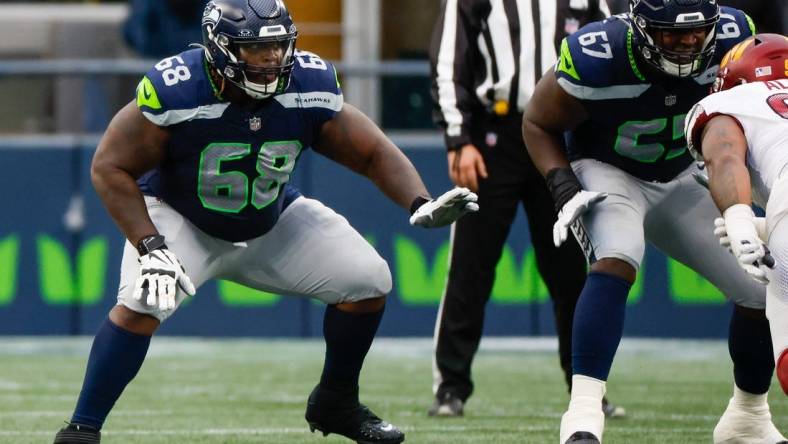 Nov 12, 2023; Seattle, Washington, USA; Seattle Seahawks guard Damien Lewis (68) reacts to a snap against the Washington Commanders during the second quarter at Lumen Field. Mandatory Credit: Joe Nicholson-USA TODAY Sports