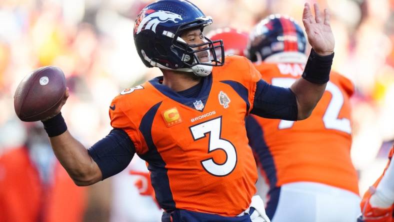 Nov 26, 2023; Denver, Colorado, USA; Denver Broncos quarterback Russell Wilson (3) throws the ball in the second quarter against the Cleveland Browns at Empower Field at Mile High. Mandatory Credit: Ron Chenoy-USA TODAY Sports