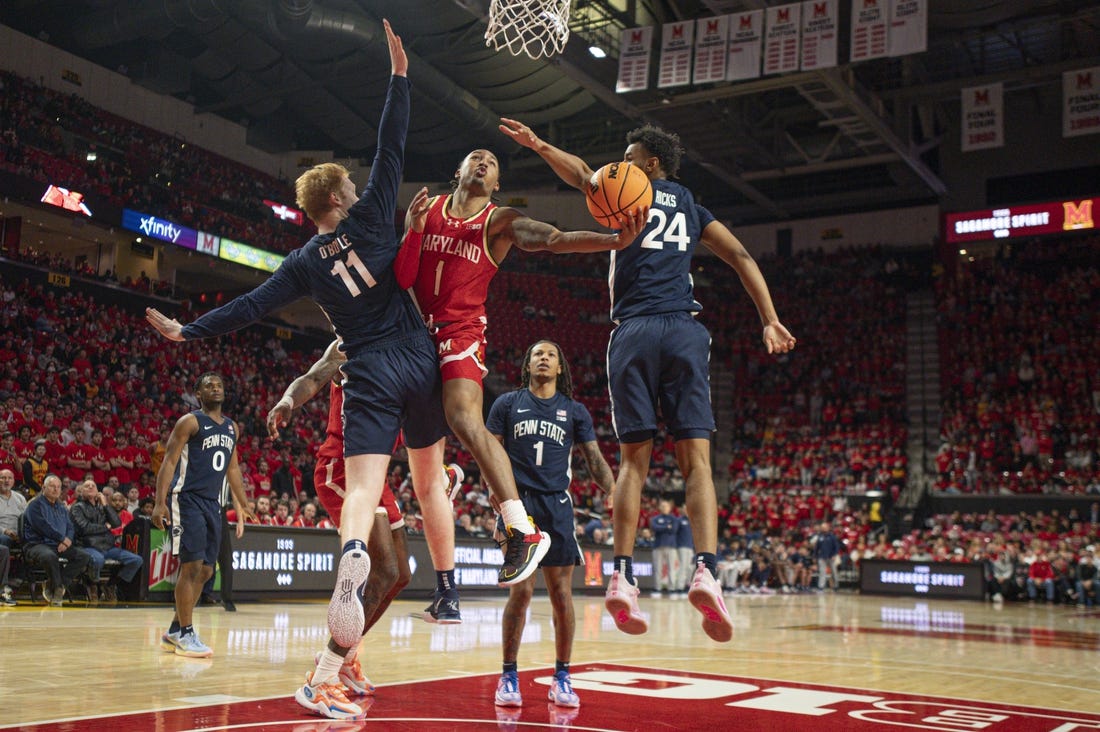Dec 6, 2023; College Park, Maryland, USA;  Maryland Terrapins guard Jahmir Young (1) shoots around Penn State Nittany Lions forward Leo O'Boyle (11) during the second half at Xfinity Center. Mandatory Credit: Tommy Gilligan-USA TODAY Sports