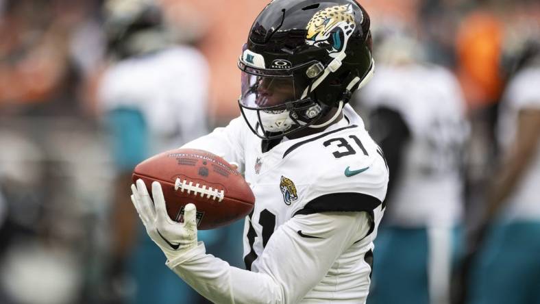 Dec 10, 2023; Cleveland, Ohio, USA; Jacksonville Jaguars cornerback Darious Williams (31) catches the ball during warm ups before the game against the Cleveland Browns at Cleveland Browns Stadium. Mandatory Credit: Scott Galvin-USA TODAY Sports