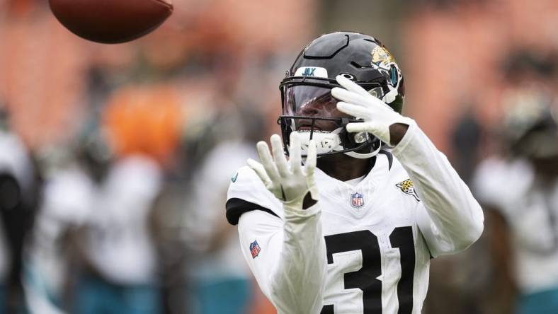 Dec 10, 2023; Cleveland, Ohio, USA; Jacksonville Jaguars cornerback Darious Williams (31) catches the ball during warm ups before the game against the Cleveland Browns at Cleveland Browns Stadium. Mandatory Credit: Scott Galvin-USA TODAY Sports