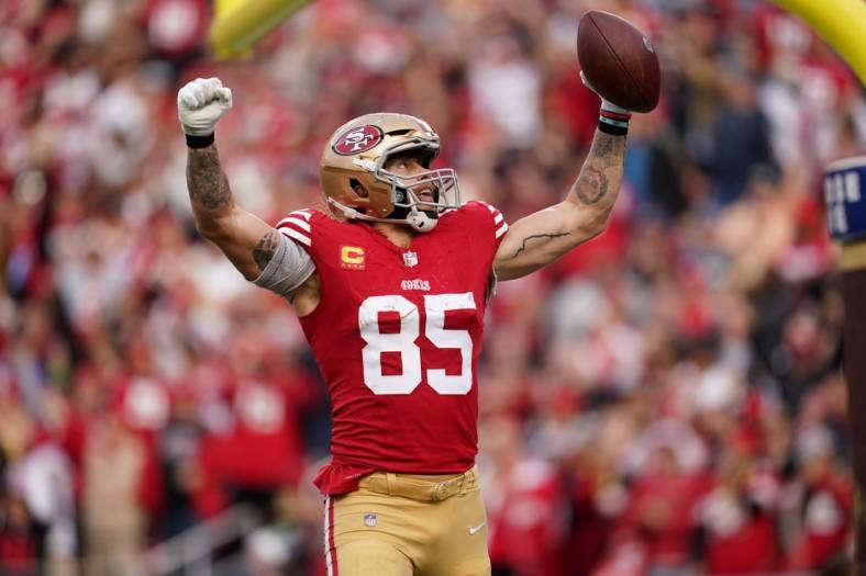 Dec 10, 2023; Santa Clara, California, USA; San Francisco 49ers tight end George Kittle (85) celebrates after scoring a touchdown against the Seattle Seahawks in the fourth quarter at Levi's Stadium. Mandatory Credit: Cary Edmondson-USA TODAY Sports
