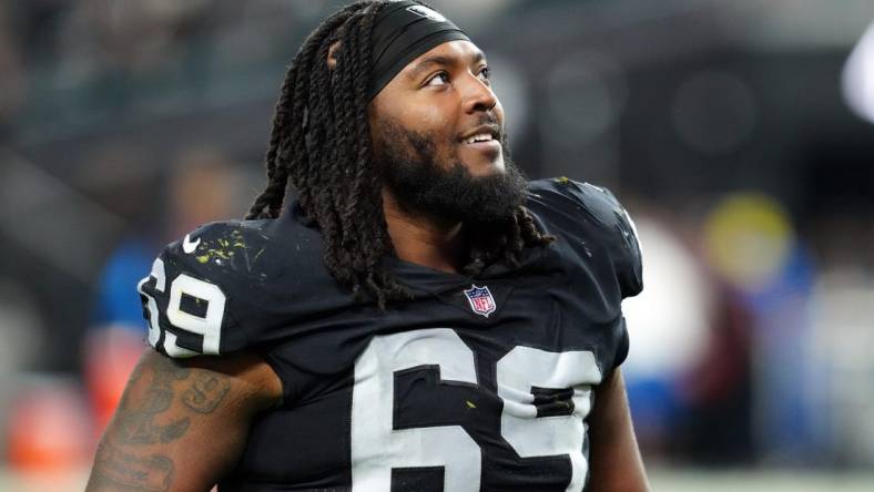 Dec 14, 2023; Paradise, Nevada, USA;  Las Vegas Raiders defensive tackle Adam Butler (69) smiles after the game against the Los Angeles Chargers at Allegiant Stadium. Mandatory Credit: Stephen R. Sylvanie-USA TODAY Sports