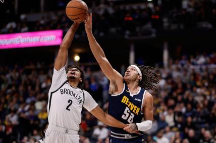 Dec 14, 2023; Denver, Colorado, USA; Brooklyn Nets forward Cam Johnson (2) and Denver Nuggets forward Aaron Gordon (50) battle for the ball in the third quarter at Ball Arena. Mandatory Credit: Isaiah J. Downing-USA TODAY Sports