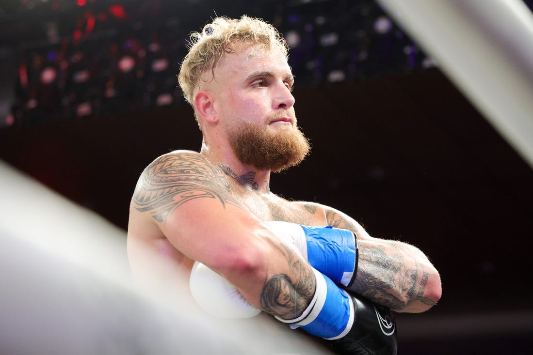 Dec 15, 2023; Orlando, Florida, USA;  Jake Paul reacts after knocking out Andre August in the first round at Caribe Royale Orlando. Mandatory Credit: Nathan Ray Seebeck-USA TODAY Sports