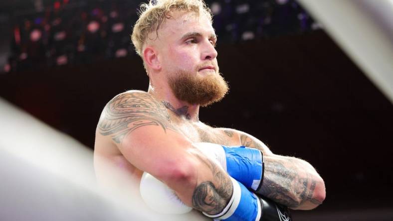 Dec 15, 2023; Orlando, Florida, USA;  Jake Paul reacts after knocking out Andre August in the first round at Caribe Royale Orlando. Mandatory Credit: Nathan Ray Seebeck-USA TODAY Sports