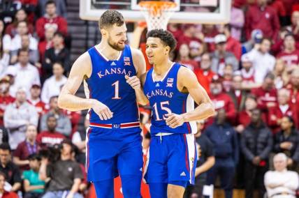 Dec 16, 2023; Bloomington, Indiana, USA; Kansas Jayhawks center Hunter Dickinson (1) and  guard Kevin McCullar Jr. (15) celebrate in the second half against the Indiana Hoosiers at Simon Skjodt Assembly Hall. Mandatory Credit: Trevor Ruszkowski-USA TODAY Sports