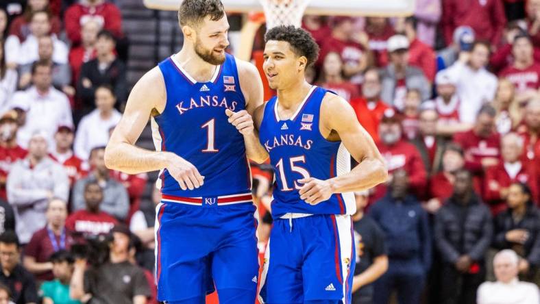 Dec 16, 2023; Bloomington, Indiana, USA; Kansas Jayhawks center Hunter Dickinson (1) and  guard Kevin McCullar Jr. (15) celebrate in the second half against the Indiana Hoosiers at Simon Skjodt Assembly Hall. Mandatory Credit: Trevor Ruszkowski-USA TODAY Sports