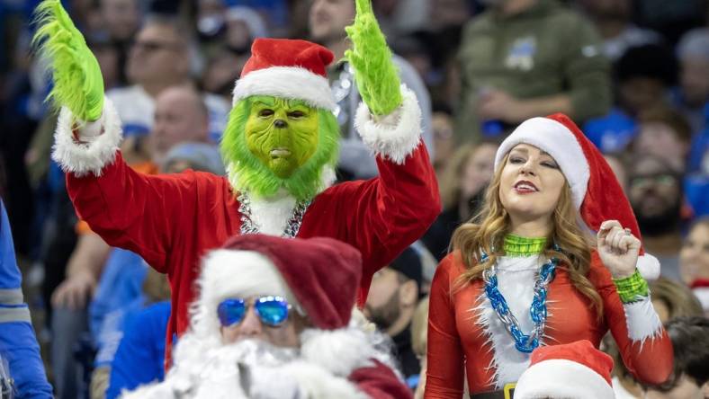 Dec 16, 2023; Detroit, Michigan, USA;  Detroit Lions fans dressed in Christmas attire react in the first half against the Denver Broncos at Ford Field. Mandatory Credit: David Reginek-USA TODAY Sports