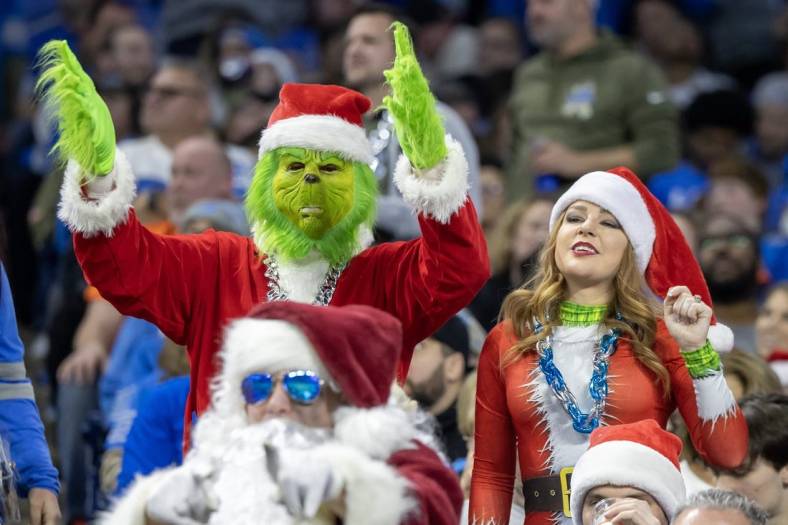 Dec 16, 2023; Detroit, Michigan, USA;  Detroit Lions fans dressed in Christmas attire react in the first half against the Denver Broncos at Ford Field. Mandatory Credit: David Reginek-USA TODAY Sports
