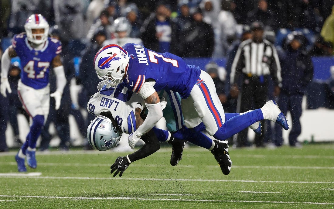 Buffalo Bills cornerback Taron Johnson (7) makes the tackle on Dallas Cowboys wide receiver CeeDee Lamb (88).